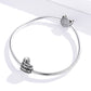 Snake chain bracelet with two sterling silver Colosseum charm beads and textured caps