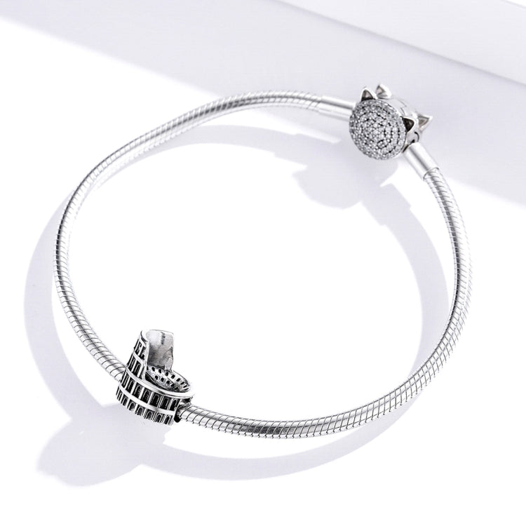 Snake chain bracelet with two sterling silver Colosseum charm beads and textured caps