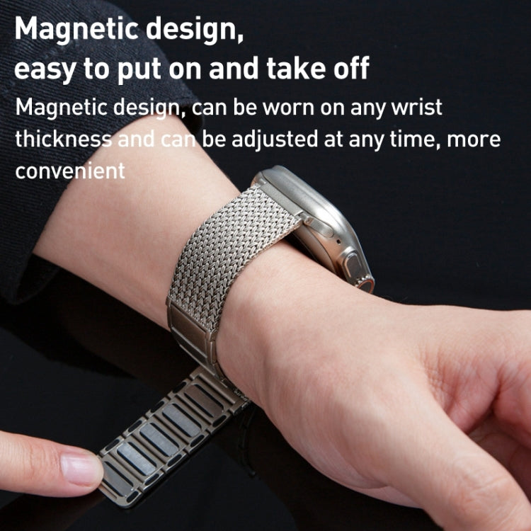 Braided stainless steel watch band with magnetic clasp, silver, worn on wrist