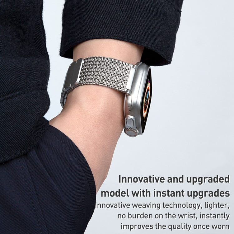 Silver braided mesh watch band on wrist, magnetic clasp closure