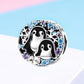 Sterling silver penguin bracelet charm with black enamel penguins and blue/purple gems