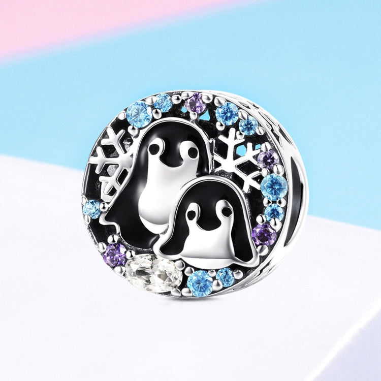 Sterling silver penguin bracelet charm with black enamel penguins and blue/purple gems