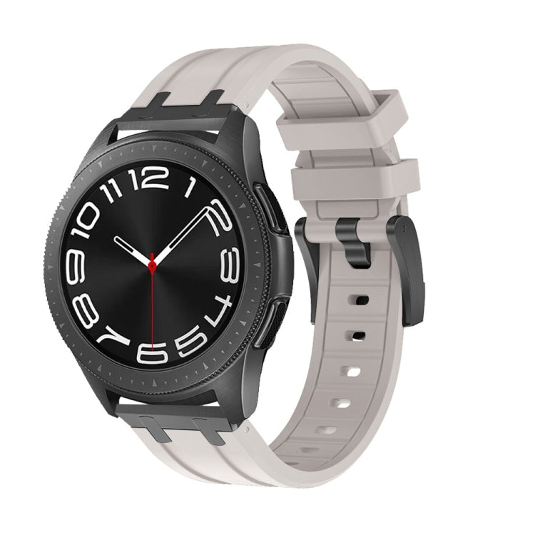 Smartwatch with a light gray silicone band, black case, and black dial