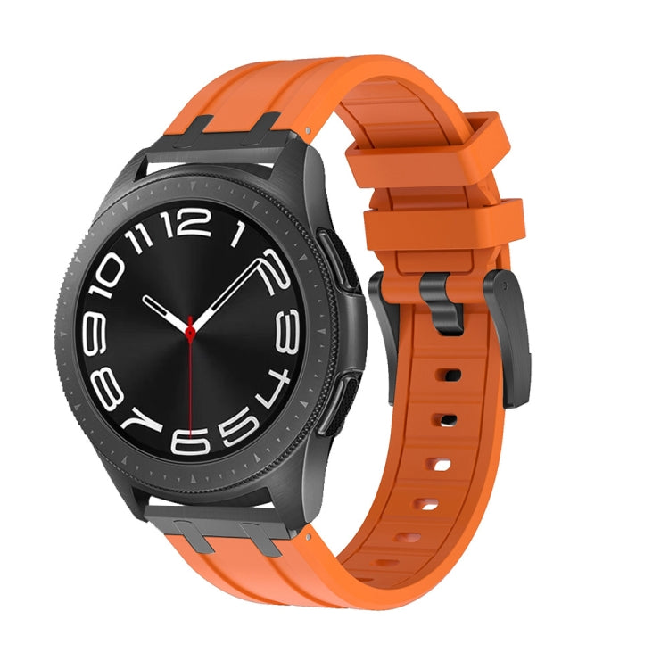 Smartwatch with orange silicone band, buckle, and adjustment holes