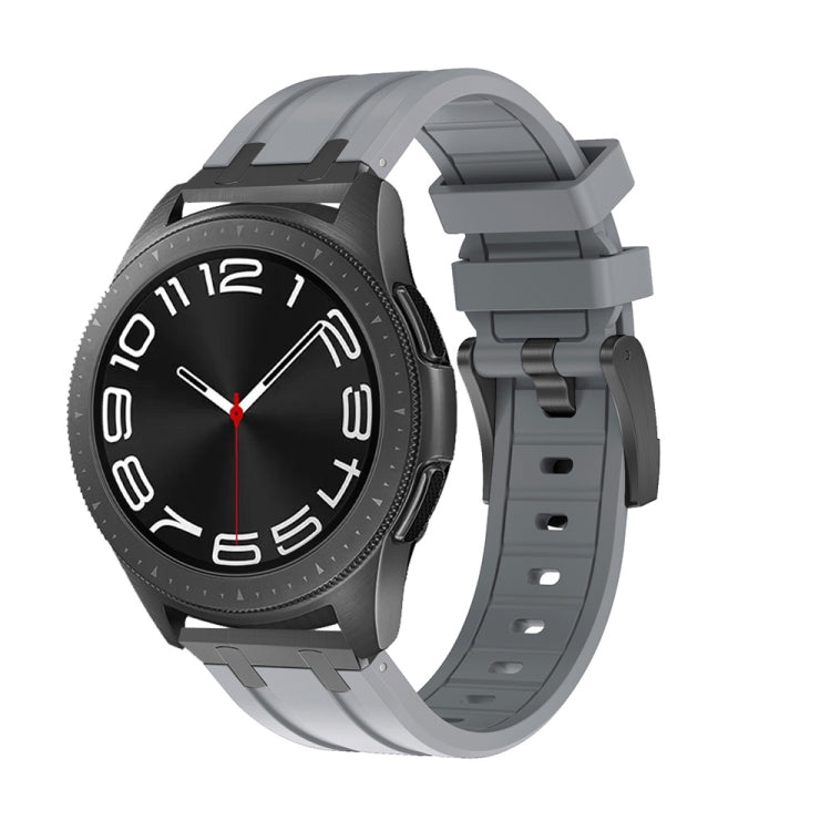 Smartwatch with gray silicone band, buckle, and adjustment holes