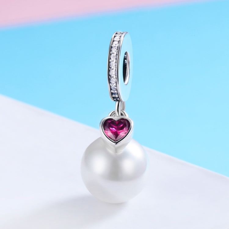 Silver heart pendant charm with bright red gem and round white pearl