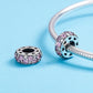 Sterling silver heart cutout bead charm with purple crystals, shown loose and on snake chain