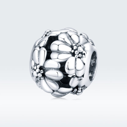 Sterling silver daisy charm bead with oxidized floral texture and round clasp ring