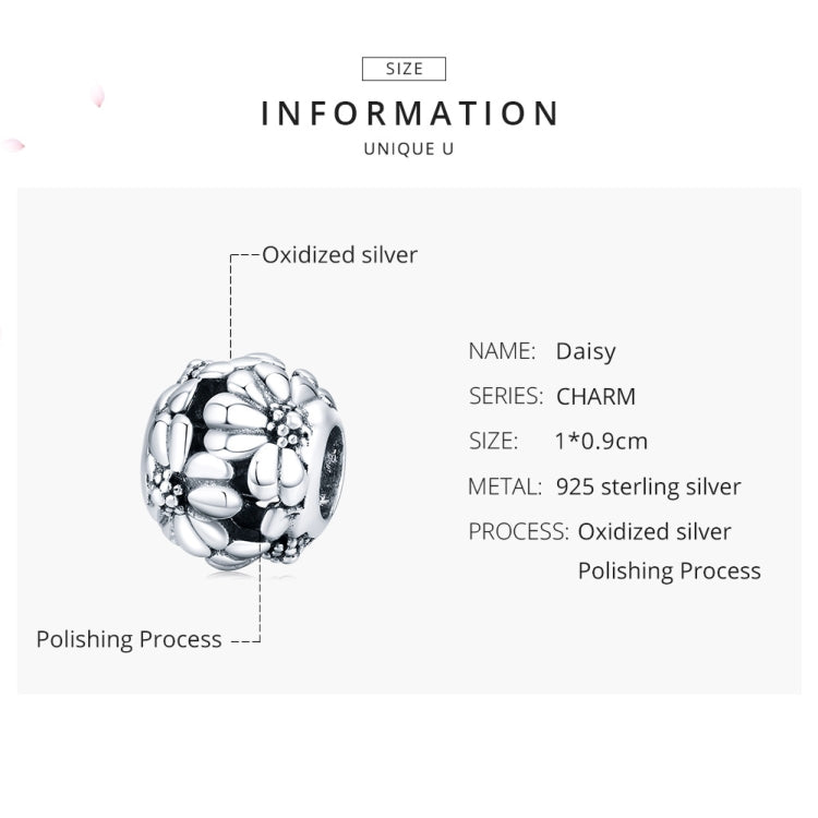 Sterling silver daisy charm bead on card display, embossed petals with dark center