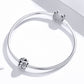 Sterling silver snake chain bracelet with daisy charm bead and sparkling round clasp charm