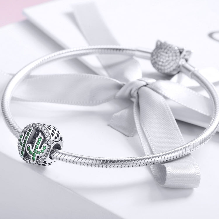 Sterling silver charm bracelet with round cactus charm bead and green crystal inlay