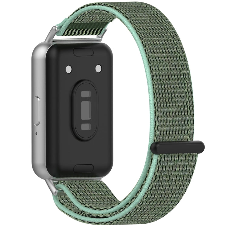 Back view of a smartwatch with a green nylon loop band and mint edging