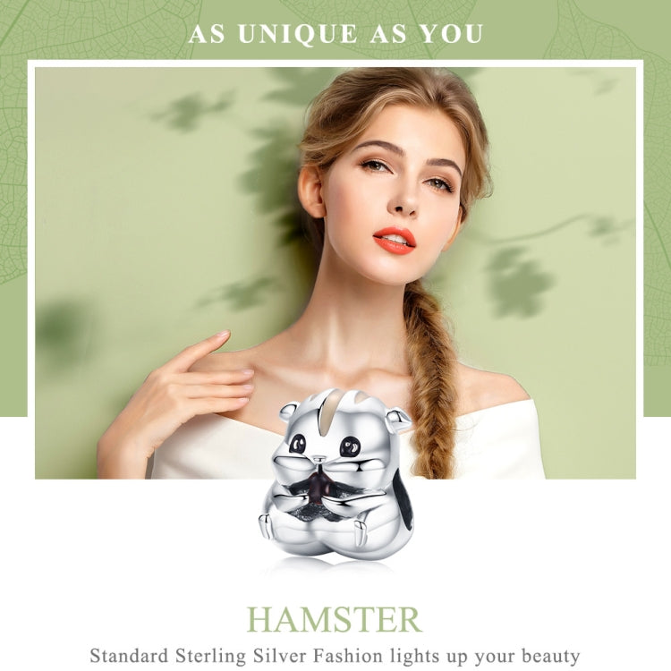 Hamster charm bead on a bracelet held by a woman, sterling silver with enamel face