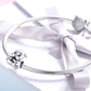 Sterling silver hamster charm bead on a flexible bracelet with ribbon bow