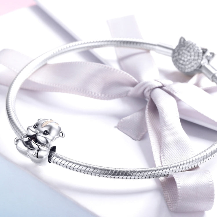 Sterling silver hamster charm bead on a flexible bracelet with ribbon bow