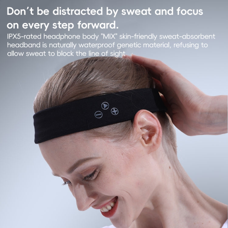 Close-up of a black Bluetooth sports headband with control buttons, worn above the ear.