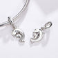 Silver-tone dolphin charm pendants on chain bracelet with round connector caps