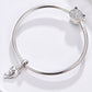 Silver-tone snake-chain bracelet with dolphin charm and rhinestone cat charm