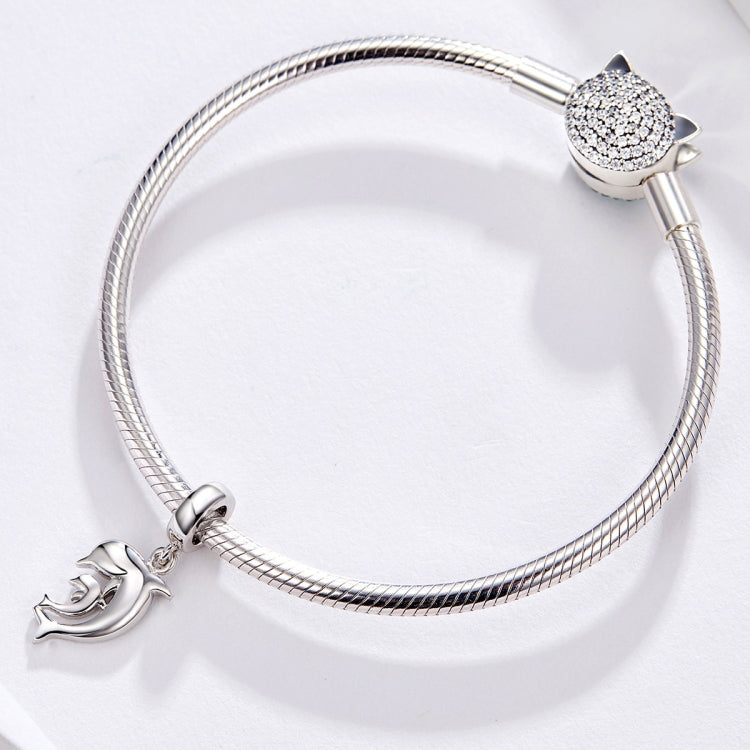 Silver-tone snake-chain bracelet with dolphin charm and rhinestone cat charm
