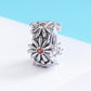 Sterling silver daisy wreath bead charm with orange flower centers, side view