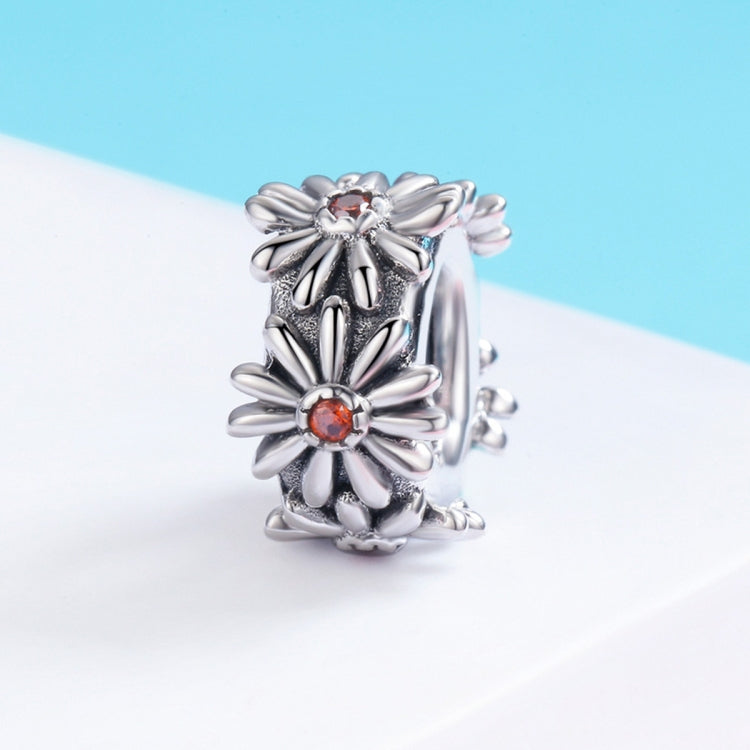 Sterling silver daisy wreath bead charm with orange flower centers, side view