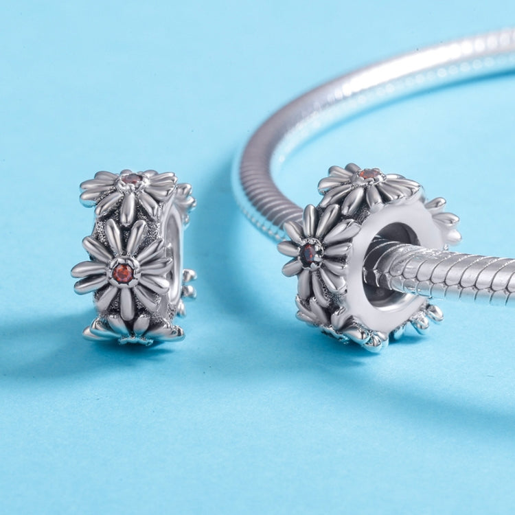 Pair of sterling silver daisy wreath bead charms with orange centers, side and front views