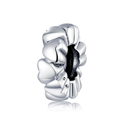 Heart-shaped silver charm bead with heart-to-heart links, polished and dark oxidized center