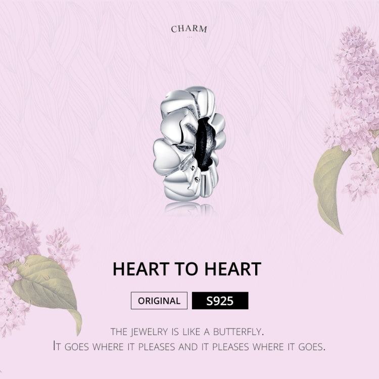 Silver heart charm bead centered on card, heart-to-heart link design