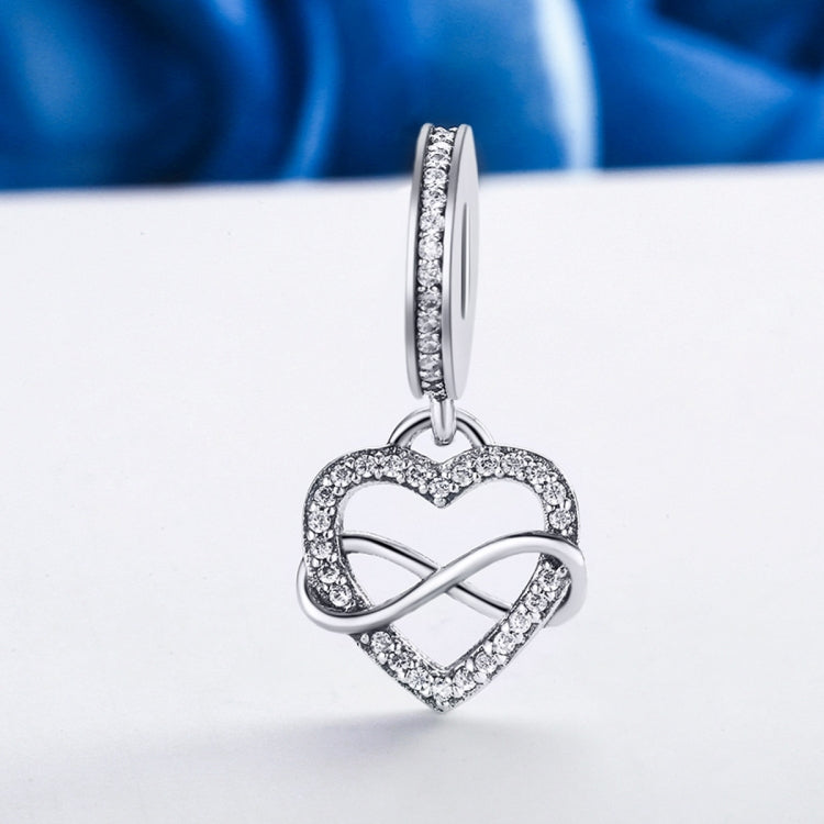 Sterling silver heart-shaped pavé crystal pendant charm with infinity detail