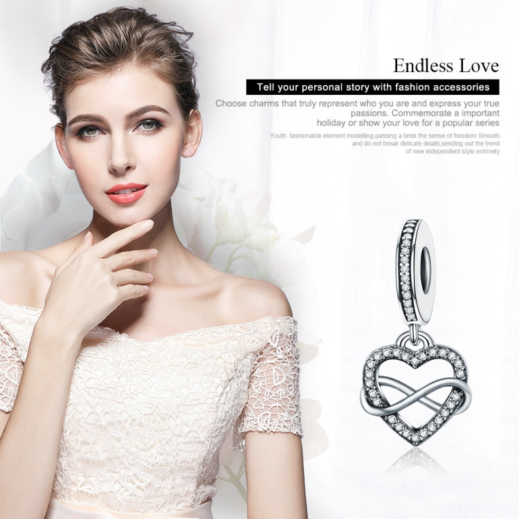 Sterling silver heart-shaped diamond pendant charm with infinity accent