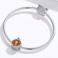 Sterling silver bracelet with grapefruit charm bead and green enamel leaf detail
