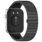 Back view of a black linked stainless steel watch band attached to a smartwatch.