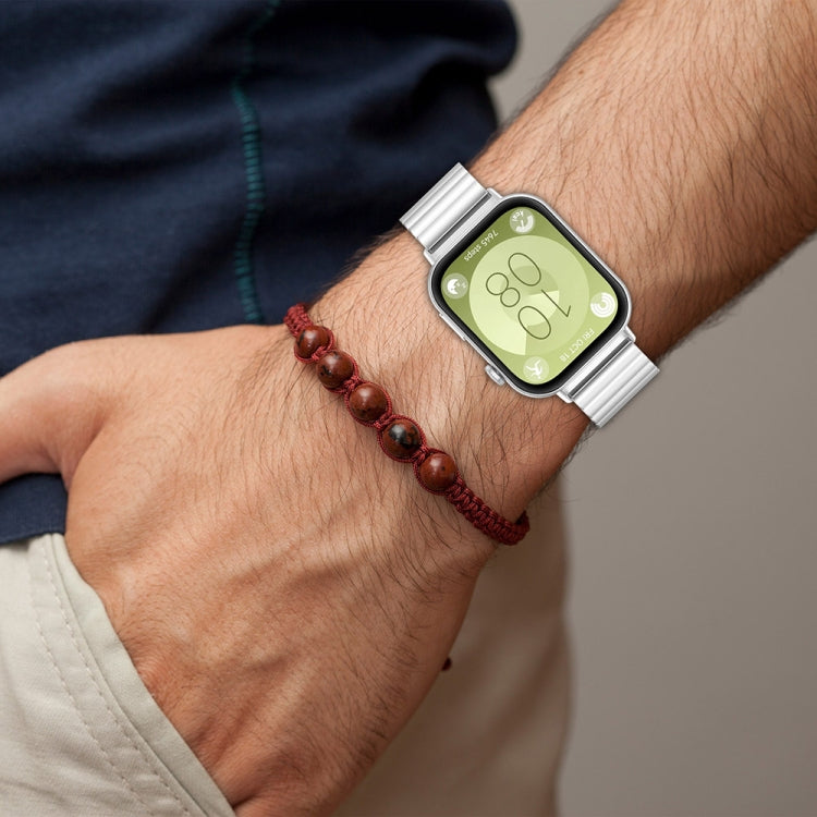 Silver stainless steel watch band with linked design, shown on a smartwatch