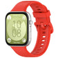 Red silicone sports watch band attached to a smartwatch, shown from the display side