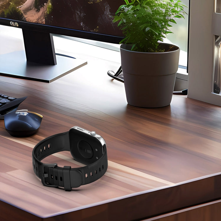 Black silicone sports watch band attached to a smartwatch, shown from the back