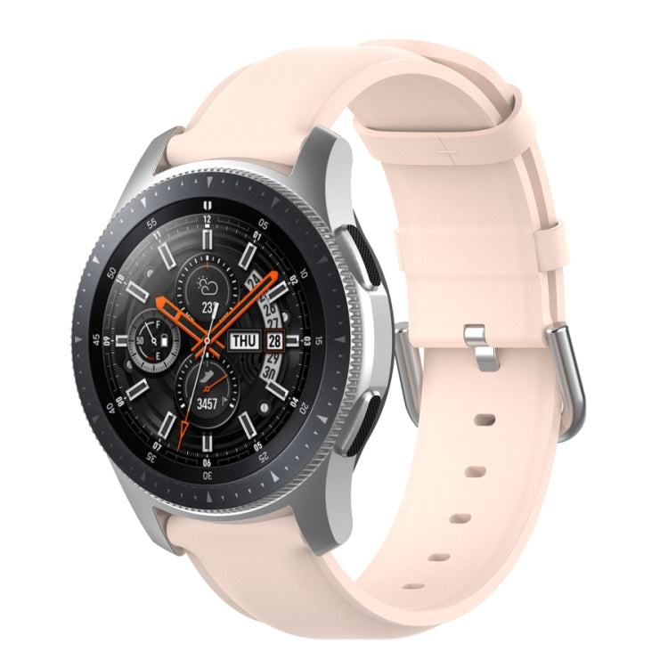 Light pink watch strap with round tail buckle and silver clasp, perforated band