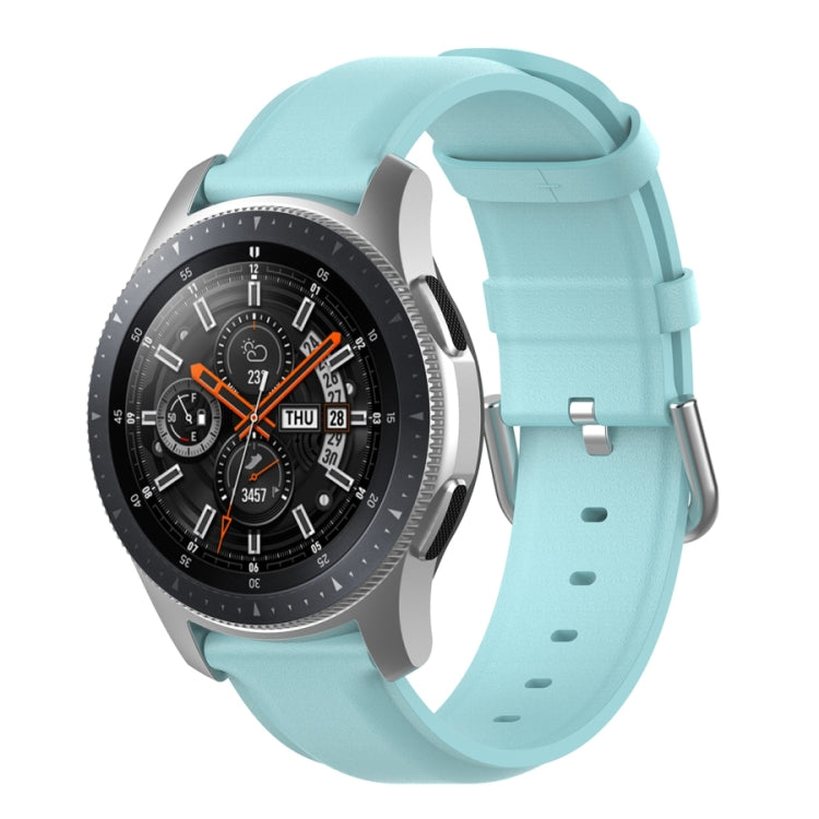 Light blue watch strap with round tail buckle and silver clasp, perforated band
