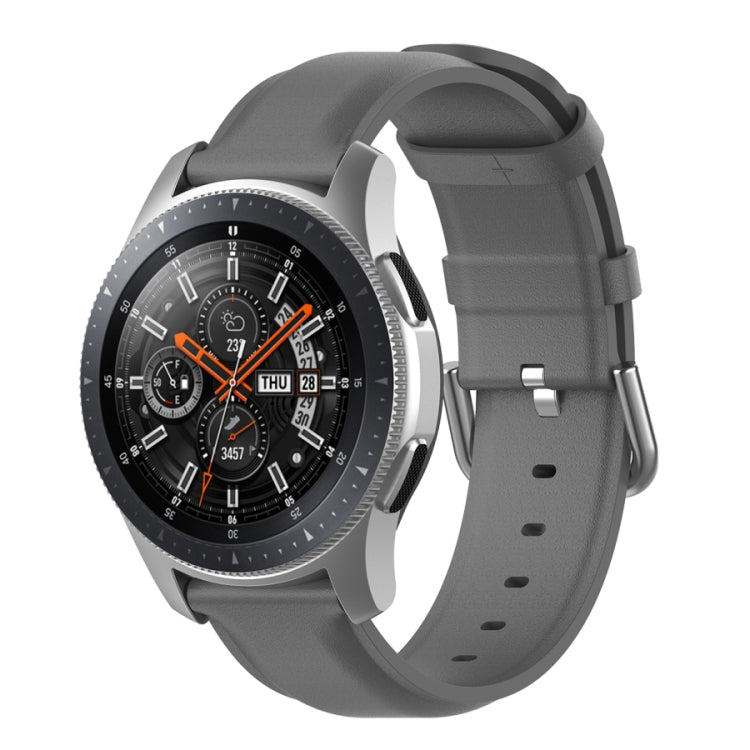 Dark gray watch strap with round tail buckle and silver clasp, perforated band