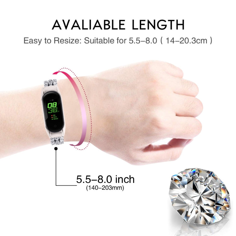 Diamond-studded replacement wrist strap, silver, worn on wrist with fitness tracker