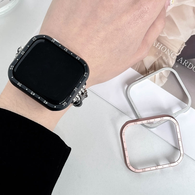 Black aluminum alloy Apple Watch case worn on the wrist, with silver and rose gold frames