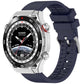 Midnight blue fluororubber watch band fitted to a silver smartwatch.