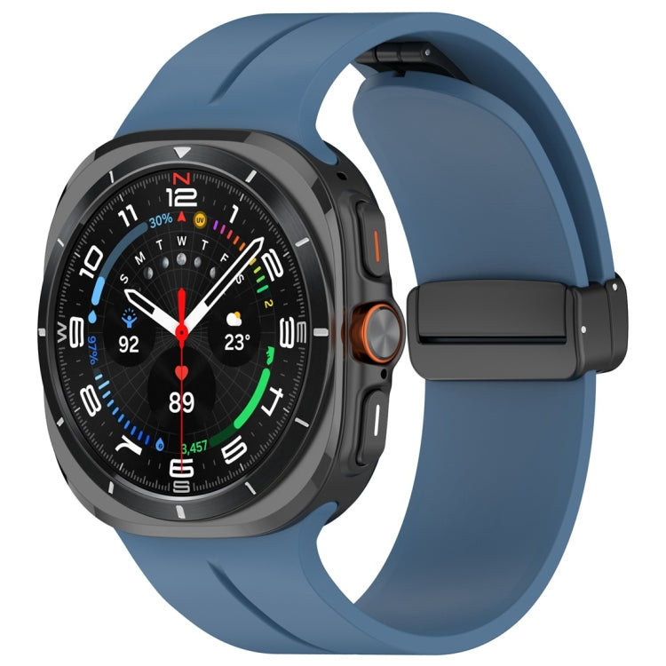 Blue silicone magnetic folding buckle watch band attached to a smartwatch