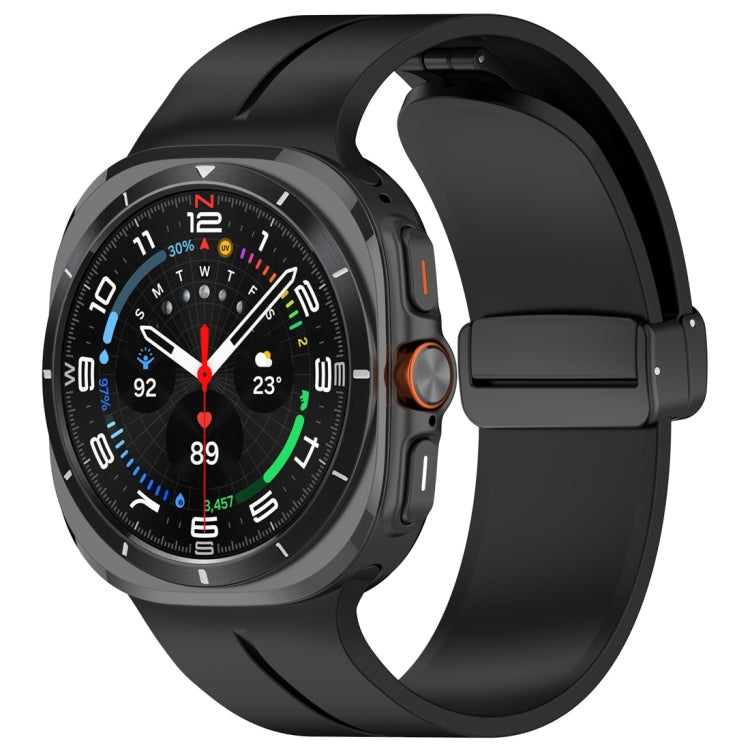 Black silicone magnetic folding buckle watch band attached to a smartwatch