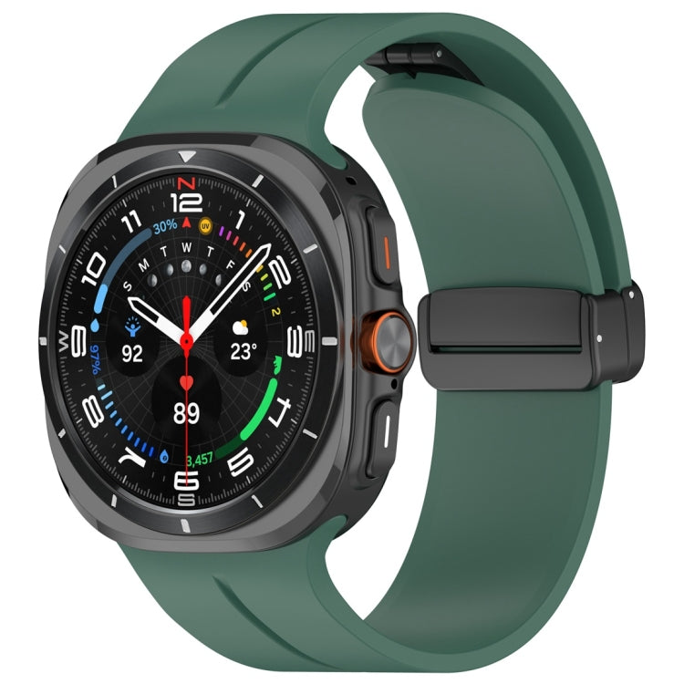 Dark green silicone watch band with magnetic folding clasp attached to a dark smartwatch