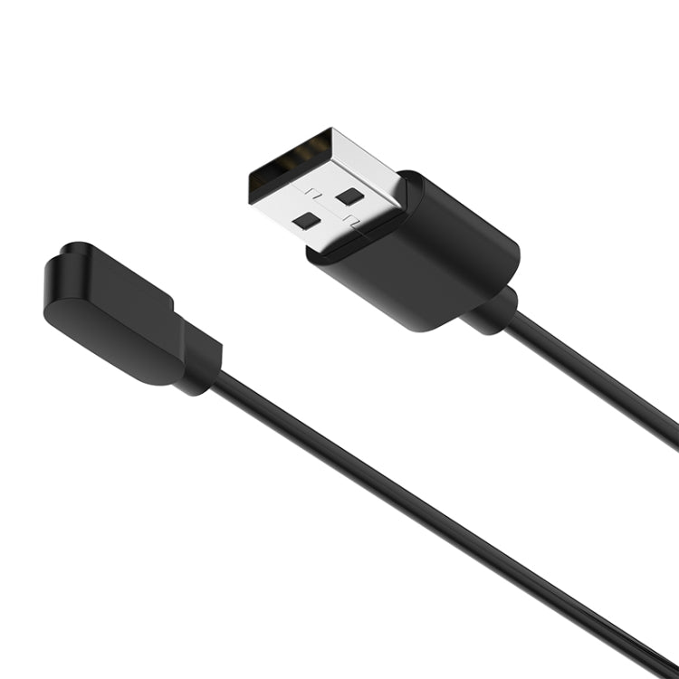 Close-up of black smartwatch cable's USB-A plug and magnetic charging head