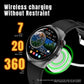 Smartwatch with black silicone strap and round display, shown on a wireless charging pad.