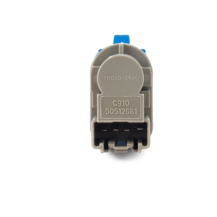 Brake light switch with labeled gray back and black electrical contacts
