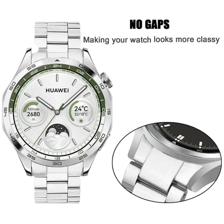 Silver stainless steel watch band fitted to a watch, with a close-up of the curved end links.