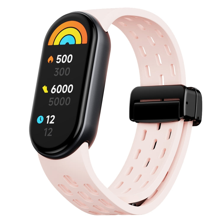 Pale pink silicone watch band for Xiaomi Smart Band 9 with perforations and black folding buckle