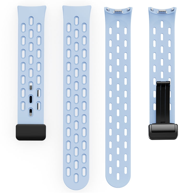 Light blue perforated silicone watch band shown in two pieces with magnetic buckle hardware